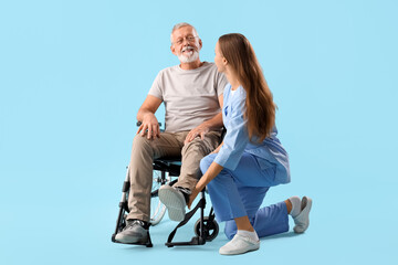 Sticker - Senior man in wheelchair with nurse on blue background