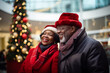 © Kalim - Photo of black mature senior couple on Christmas market