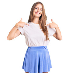 Wall Mural - Young beautiful blonde woman wearing summer style looking confident with smile on face, pointing oneself with fingers proud and happy.