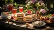 A sumptuous afternoon tea spread, replete with finger sandwiches and scones, as part of a Wimbledon watching party.
