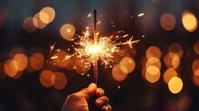 Close-up Of A Hand Holding Sparklers For Guy Fawkes Night.