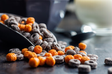 Sweet breakfast cereals on kitchen table.