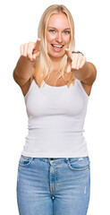 Canvas Print - Young blonde girl wearing casual style with sleeveless shirt pointing to you and the camera with fingers, smiling positive and cheerful