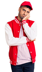 Canvas Print - Young hispanic man wearing baseball uniform thinking looking tired and bored with depression problems with crossed arms.