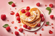 Heart shaped pancakes with raspberries  for St. Valentine's Day.