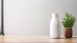 © olegganko - white milk bottle with blank front, realistic on a mockup template in a wooden table
