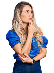 Sticker - Young blonde woman wearing casual clothes thinking worried about a question, concerned and nervous with hand on chin