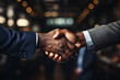 © Gonzalo - Business handshake, two corporate men shaking hands, making a deal in office