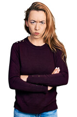 Sticker - Young caucasian woman wearing casual clothes skeptic and nervous, disapproving expression on face with crossed arms. negative person.