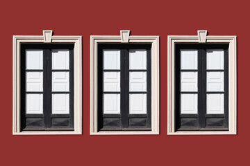 Wall Mural - Row of windows. Spanish architecture background. Three windows frame isolated in a row. Retro style window. Antique european street. Building facade. Empty copy space. Italian style balcony window.