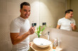 © unai - Man smiling after cleaning his teeth in the bathroom