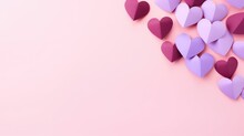 Violet And  Burgundy Color Paper Hearts Folded  I On A Pastel Pink Background With Copy Space 