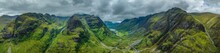 Aerial Panorama Of The Prominent Mountain Range And The Three Peaks Of Three Sisters Of Glen Coe, Up To 1150 Metres High, With The Elevated Side Valley Hidden Or Lost Valley On The Left And The 953