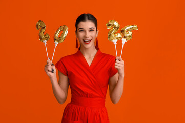 Poster - Beautiful young happy woman with figure 2024 made of balloons on orange background. Chinese New Year celebration