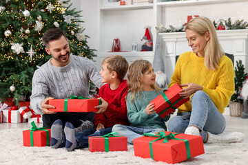 Poster - Happy family with Christmas gifts at home