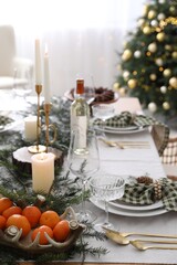 Poster - Christmas table setting with festive decor and dishware indoors