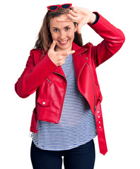 Canvas Print - Young beautiful blonde woman wearing casual leather jacket smiling making frame with hands and fingers with happy face. creativity and photography concept.