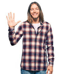 Wall Mural - Handsome caucasian man with long hair wearing hipster shirt showing and pointing up with fingers number five while smiling confident and happy.