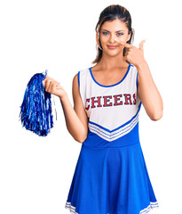 Poster - Young beautiful woman wearing cheerleader uniform pointing with hand finger to face and nose, smiling cheerful. beauty concept