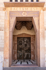 Wall Mural - The main decorative entrance door to the Church of the Annunciation in the Nazareth city in northern Israel