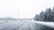 Driving down the highway during a winters storm in Ottawa, Ontario. Road is covered by snow, cars, passing by, fog