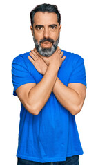 Sticker - Middle aged man with beard wearing casual blue t shirt shouting and suffocate because painful strangle. health problem. asphyxiate and suicide concept.