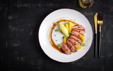 Wall Mural - Traditional gourmet duck breast fillet with mashed potatoes and orange sauce. Top view, overhead