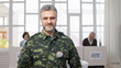 © Synthex🇺🇦 - Portrait of a soldier with a vote pin at the polling place, exercising his voting right and civic duty