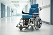 Modern electric wheelchair in hospital. Medical care. Collapsible wheelchair in empty corridor. Copy space.