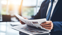 The Head Of Revenue Operations Reviewing A Financial Newspaper, Staying Informed, Head Of Revenue Operations, Blurred Background, With Copy Space