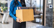 © Charlie's - Quit Job asian business woman sending resignation letter and packing Stuff Resign Depress or carrying business cardboard box in office. Change of job or fired from company