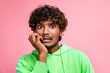 Portrait of funny unlucky student indian guy biting his nails before graduation exam in university isolated on pink color background