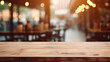 Empty Wooden Table in a Blurry Restaurant Background