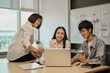 © Prathankarnpap - Senior female manager helping and explaining work process to new employees