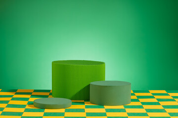 Wall Mural - Several podiums in green color are displayed on green and yellow checked surface. Vacant space. Abstract composition in minimal design