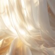 Close-up of luxurious cream-colored cloth with a gentle gradient caused by soft lighting
