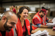Joyful female warehouse worker laughing with colleagues in a busy distribution center environment.
