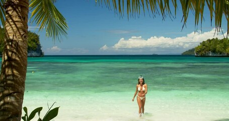 Canvas Print - Ocean beach, blowing kiss and woman walking, relax and wellness on island vacation, holiday or summer break. Affection, water waves and bikini girl flirt on sea adventure, nature or snorkeling trip