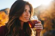 woman sipping amber ale outdoors