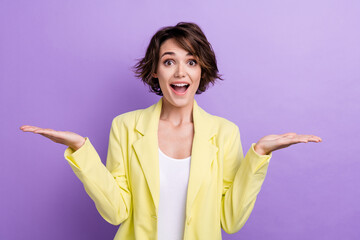 Poster - Portrait of young lady surprised wear lime stylish suit holding two arms crazy promotion cheap options isolated on purple color background