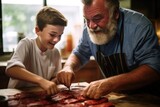 Fototapeta  - boy assisting his father in marinating steak