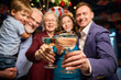 © Svitlana - Clinking glasses with champagne in hands of group of people at Christmas