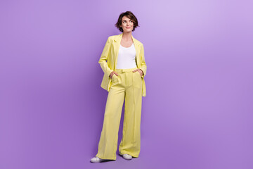 Canvas Print - Full length photo of dreamy thoughtful woman dressed yellow jacket looking empty space isolated purple color background