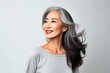 © Izhar - Japanese woman in her adult years, her skin smooth and healthy. Gorgeous elderly Asian woman with long gray hair and a content smile on her face. Advertising concept for skincare and cosmetics