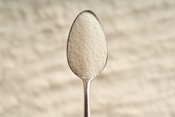 Wall Mural - Collagen powder on a metal spoon
