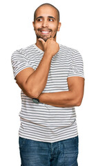 Sticker - Hispanic adult man wearing casual clothes with hand on chin thinking about question, pensive expression. smiling with thoughtful face. doubt concept.