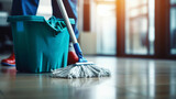 Fototapeta Dziecięca - copy space, stockphoto, people Mopping an Office Floor, Mop Close-Up, Cleaner Cleans the Floors. Professional cleaning team cleaning floor in an office or business building.