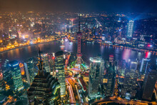 Aerial View Of Shanghai Skyline And Financial District Along Huangpu River At Night, China.