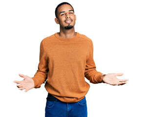 Young african american man wearing casual clothes smiling showing both hands open palms, presenting and advertising comparison and balance