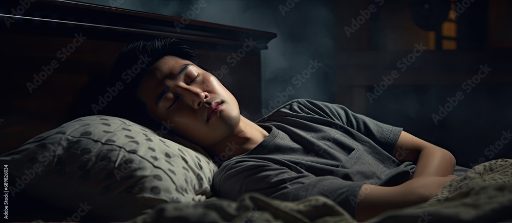 asian man in bed suffering insomnia and sleep disorder thinking about ...